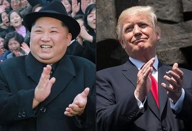 Kim and Trump clapping