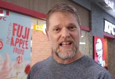 Greg Hadley trying KFC in Singapore