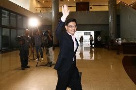 heng swee keat walking into parliament