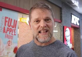 Greg Hadley trying KFC in Singapore